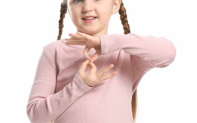 Cute deaf mute girl using sign language on white background